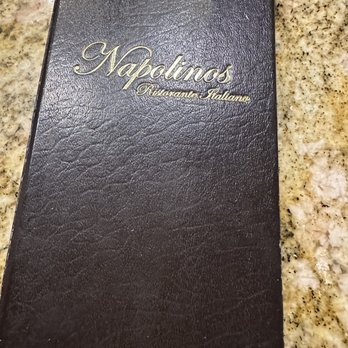 Napolinos - a close up of a menu on a granite countertop - Italian Near Me - Wildwood, Florida Napolinos - a close up of a menu on a granite countertop - Italian Near Me - Wildwood, Florida