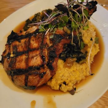 Rootstock - Porkchop with cornbread grits, sautéed kale with a sole gastrique - Venues & Event Spaces Near Me - Woodstock, Georgia
