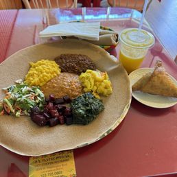 Veggie Vegan Sampler Platter Freshly Squeezed Mango Juice Lentil Samosa Veggie Vegan Sampler Platter Freshly Squeezed Mango Juice Lentil Samosa