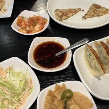 Myungin Dumplings - Top- kimchi, onion pancake, pan fried dumplings, radish/jalapeño, shredded cabbage salad, sauce for pancake and dumplings. - Korean Near Me - Northridge, California Myungin Dumplings - Top- kimchi, onion pancake, pan fried dumplings, radish/jalapeño, shredded cabbage salad, sauce for pancake and dumplings. - Korean Near Me - Northridge, California