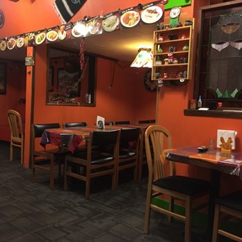 El Molcajete - a restaurant with orange walls - Mexican Near Me - Flemington, New Jersey