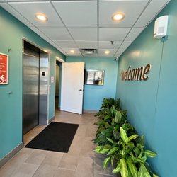 Prana Hot Yoga + Bodywork - Elevator / stairs to access studio in second floor