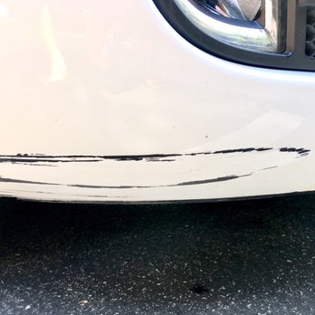 Finish Pro - Before pic: a scratch parking against a high curb - Body Shops Near Me Finish Pro - Before pic: a scratch parking against a high curb - Body Shops Near Me