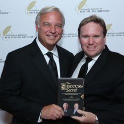 Peak Performance Martial Arts - Master Schill and Jack Canfield hanging the National Academy of Best Sellers. Promoting their best seller "The Success Secret".
