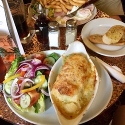 Wheel Inn - Foreground: leek, potato and cheese bake with salad and garlic bread. Rear: Ham, egg & chips.