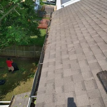 Victors Tree Services & Landscaping - a man working on a roof - Landscaping Near Me Victors Tree Services & Landscaping - a man working on a roof - Landscaping Near Me