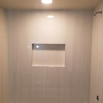 GJB Construction - a bathtub in a bathroom - Flooring Near Me - Frederick, Maryland