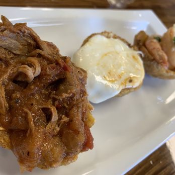 La Guagua - Tostones Rellenos 13.95 Stuffed plantain cups filled with our Sauteed Garlic Shrimp, Ropa Vieja and Mozzarella Cheese & Mojo Sauce - Latin American Near Me - Vacaville, California