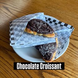 Froth - Croissant pressed in panini press, topped with chocolate spread, powder sugar