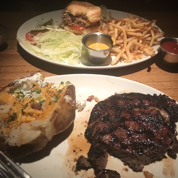 Bartlett's - Hawaiian marinated steak baked potato and my friend is finishing his hamburger - Steakhouses Near Me - Austin, Texas Bartlett's - Hawaiian marinated steak baked potato and my friend is finishing his hamburger - Steakhouses Near Me - Austin, Texas