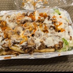 Lonzo's Kitchen - BBQ Chicken over fries and rice + salad