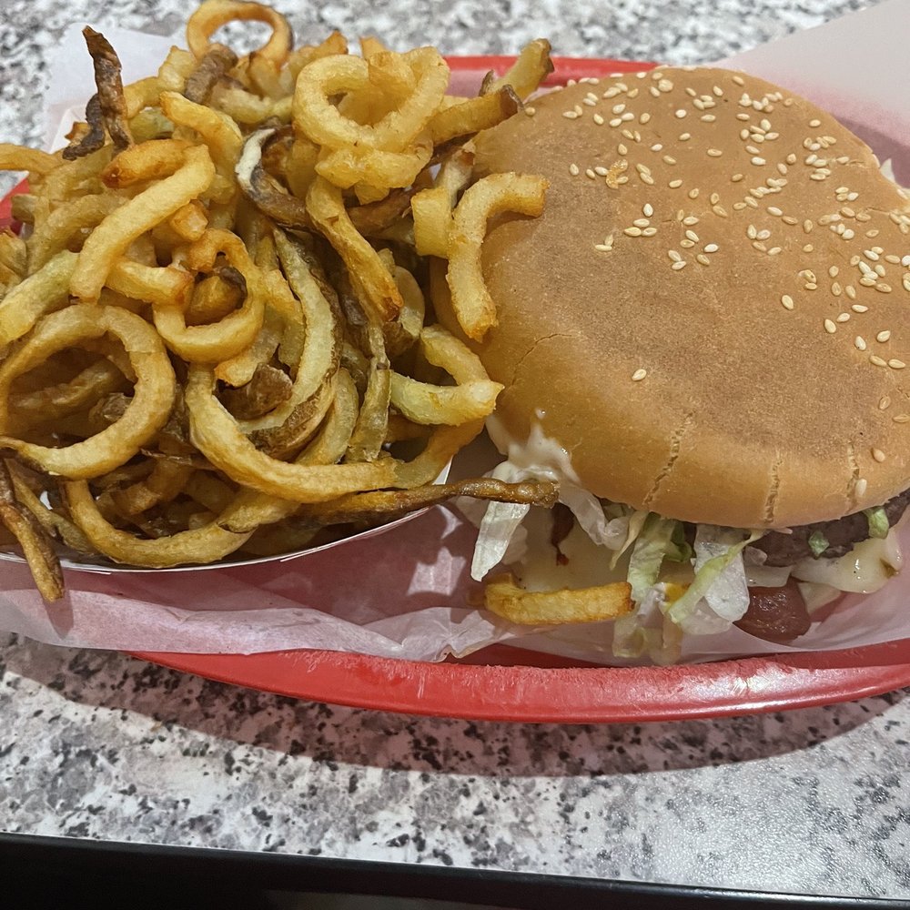 Steak burger and curly fries Steak burger and curly fries