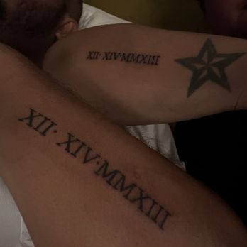 Fremont street tattoo - Matching wedding anniversary date in Roman numerals. - Tattoo Near Me - Las Vegas, Nevada Fremont street tattoo - Matching wedding anniversary date in Roman numerals. - Tattoo Near Me - Las Vegas, Nevada