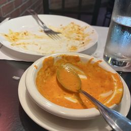 Empty plate which once held Fish Tikka, Kashmiri Naan and Baigan Bharta.