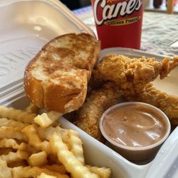 Raising Cane's Chicken Fingers - 3 finger meal, 3 chicken fingers, fries, Texas toast, and a drink