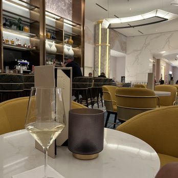 Conrad Lobby Bar - a glass of wine on a table - Bars Near Me - Las Vegas, Nevada Conrad Lobby Bar - a glass of wine on a table - Bars Near Me - Las Vegas, Nevada