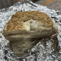 H & L Bagels - Half a sesame bagel with veggie spread