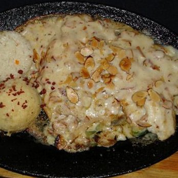 Langostino's - "Filetes Almendrado," which is deep fried fish cooked in white almond sauce. No, this isn't what you will find on the west coast of Mexico. - Mexican Near Me - Ciudad Río Bravo, TAM