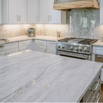 StoneWorks - a large kitchen with white cabinets and marble countertops - General Contractors Near Me - Bluffton, South Carolina StoneWorks - a large kitchen with white cabinets and marble countertops - General Contractors Near Me - Bluffton, South Carolina