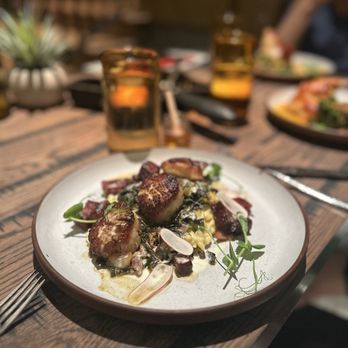 Four Brothers - Sea scallops, sliced radishes, cheesy risotto and pork belly - Southern Near Me - San Antonio, Texas Four Brothers - Sea scallops, sliced radishes, cheesy risotto and pork belly - Southern Near Me - San Antonio, Texas