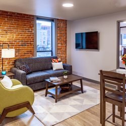 Riverfront Park Travel Apartments - Living area and dining room table at Riverfront Park Travel Apartments