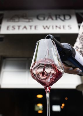 Photo of Gard Vintners Wine Tasting Room - Woodinville, WA, US. a woman pouring a glass of wine