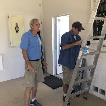 Jones Air Conditioning & Electric - David and Bill working in my electrical panel. Rare to find owners so engaged in their business. - Electricians Near Me - Naples, Florida