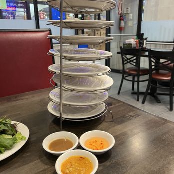 Mi Hoa Sen - a stack of plates and bowls of soup - Vietnamese Near Me - Falls Church, Virginia Mi Hoa Sen - a stack of plates and bowls of soup - Vietnamese Near Me - Falls Church, Virginia