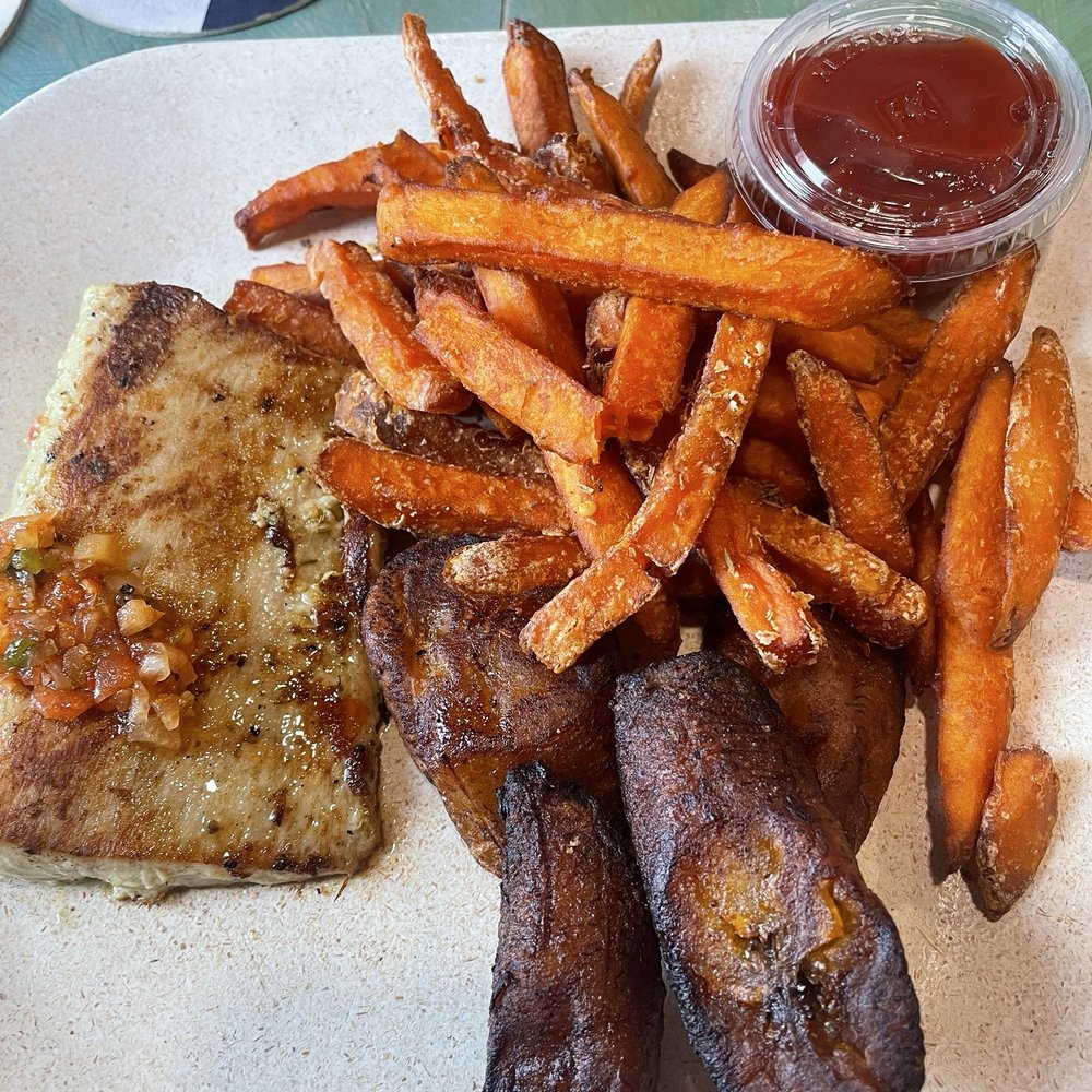 Sudi's Caribbean Bar & Grille - Mahi. Tasteless. Cooked almost too long. Plantains overcooked and hard. Sweet potato fries were the saving grace of this meal! - New American Near Me - St. Thomas, Virgin Islands Sudi's Caribbean Bar & Grille - Mahi. Tasteless. Cooked almost too long. Plantains overcooked and hard. Sweet potato fries were the saving grace of this meal! - New American Near Me - St. Thomas, Virgin Islands