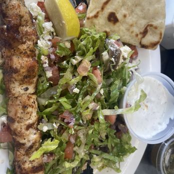 Souvlaki Grill - Shredded lettuce, Feta , onions one blackened chicken, skewer with lemon, pita bread and Tzatziki Sauce - Greek Near Me - West Palm Beach, Florida Souvlaki Grill - Shredded lettuce, Feta , onions one blackened chicken, skewer with lemon, pita bread and Tzatziki Sauce - Greek Near Me - West Palm Beach, Florida