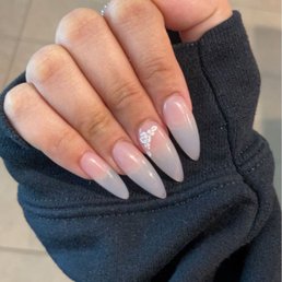 See through almond with floral design on the middle finger