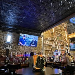 Blind Pig - Bar and a glimpse of second level. Cool limestone brick wall.