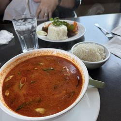Bamboo Hut Southeast Asian Cuisine - Tom Yum soup with side of vermicelli noodles.