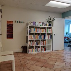 Bloom Community Midwives - Waiting area with lots of pregnancy and birthing/delivery books