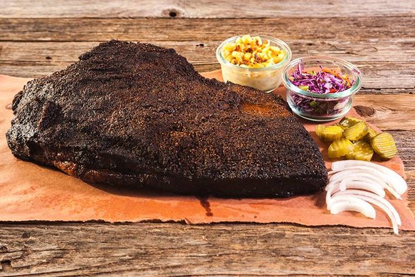 Texas-Style BBQ Delicacies|Menu - Simply Smoked BBQ is a family-owned & operated business dedicated to bringing authentic Texas barbecue to Central Ohio. Founded in a suburb of Austin, Texas in 2017, we relocated to the greater Columbus area in 2023, driven by our obsession for great barbecue & our desire to share it with new friends & neighbors. We believe that exceptional Texas-style barbecue starts with high-quality ingredients, careful attention to detail, & a 100% wood-fueled pit—because there are no shortcuts to true flavor. Our recipes have been passed down through generations, & we smoke our meats low & slow to ensure every bite is tender, flavorful, & unforgettable. You’ll taste the difference in our brisket, ribs, & pulled pork, all smoked to perfection over real wood fires. Pride is taken in offering a full barbecue experience, including scratch-made sauces, sides, & desserts that perfectly complement our smoked meats. The menu features favorites like creamy mac & cheese, tangy coleslaw, & classic potato salad, all made in-house for the freshest taste. We are committed to delivering exceptional customer service & making every event memorable. Our catering services are designed to meet the needs of any occasion, from weddings & corporate meetings to family gatherings & office parties. Menus are fully customizable, so you can mix & match dishes to suit your guests’ tastes.
