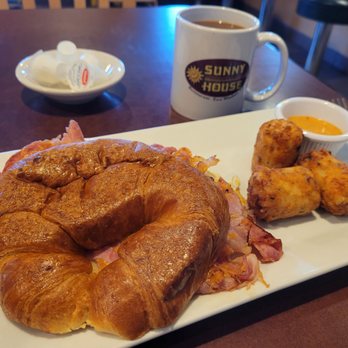 Sunny House - Chef's choice - ham egg and cheese sandwich on a croissant with loaded tater tots and some mock chik fil a sauce - Breakfast & Brunch Near Me - East Windsor, Connecticut Sunny House - Chef's choice - ham egg and cheese sandwich on a croissant with loaded tater tots and some mock chik fil a sauce - Breakfast & Brunch Near Me - East Windsor, Connecticut