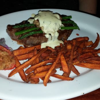 Stonewood Grill & Tavern - Well marbled cut-age beef, cooked rare, sweet potato fries, and crab cale oscar. - New American Near Me - Ormond Beach, Florida Stonewood Grill & Tavern - Well marbled cut-age beef, cooked rare, sweet potato fries, and crab cale oscar. - New American Near Me - Ormond Beach, Florida