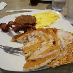 Cinnamon pancakes, bacon, sausage, and eggs. Cinnamon pancakes, bacon, sausage, and eggs.