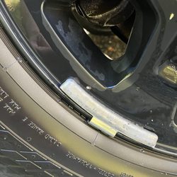 Grand Tire Pros - Chipped paint and weight on the face of custom rim.