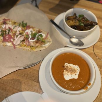 True Food Kitchen - Creamy Tomato Soup, Loaded Fingerling Potatoes, Sourdough Steet Corn Flatbread - New American Near Me - New Orleans, Louisiana True Food Kitchen - Creamy Tomato Soup, Loaded Fingerling Potatoes, Sourdough Steet Corn Flatbread - New American Near Me - New Orleans, Louisiana