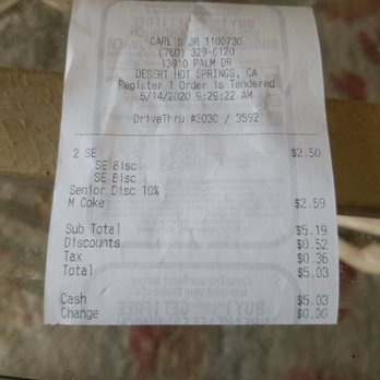 Carl's Jr - a receipt on a table - Fast Food Near Me - Desert Hot Springs, California