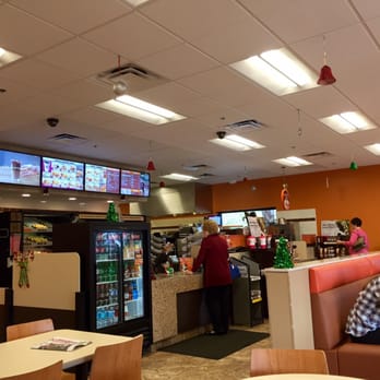 Dunkin' -  people sitting at tables in a restaurant - Donuts Near Me - Palm Coast, Florida