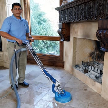 Wow Total Cleaning & Restoration - professional technician cleaning natural tile floors - Carpet Cleaning Near Me - Austin, Texas Wow Total Cleaning & Restoration - professional technician cleaning natural tile floors - Carpet Cleaning Near Me - Austin, Texas