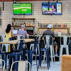 Immigrant Son Brewery - Bar and tables