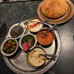 "Breaking Bread with its accompaniments."
