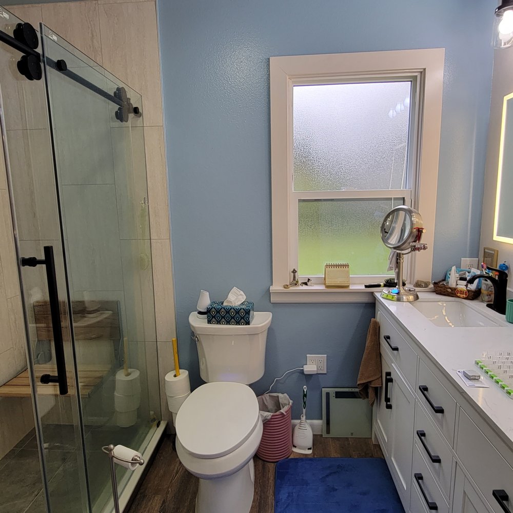 UPHOUSE - a bathroom with a toilet, sink, and shower - General Contractors Near Me UPHOUSE - a bathroom with a toilet, sink, and shower - General Contractors Near Me