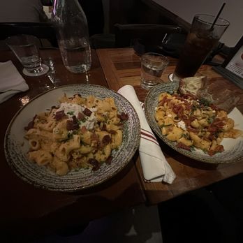 Von's 1000 Spirits - Left: Spicy "Rigs" Right: Tuscan Chicken Pasta w/bread - New American Near Me - Seattle, Washington Von's 1000 Spirits - Left: Spicy "Rigs" Right: Tuscan Chicken Pasta w/bread - New American Near Me - Seattle, Washington
