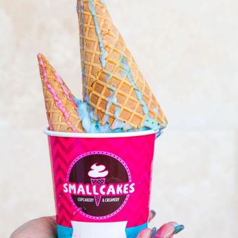 Smallcakes Belmont - a hand holding a cup of ice cream - Desserts Near Me - Belmont, North Carolina Smallcakes Belmont - a hand holding a cup of ice cream - Desserts Near Me - Belmont, North Carolina