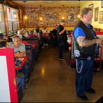 Cheryl's Diner - The cashier's station is in the middle, as the gentleman in the photo pays his tab, and the main dining room is straight ahead. - Diners Near Me - Kernville, California