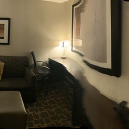 Panoramic view of the sitting area that includes a ChargePoint power station (two USBs 2 110V)